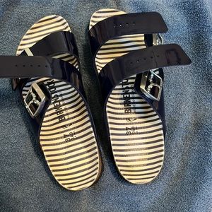 Birkenstock navy shiny sandals.